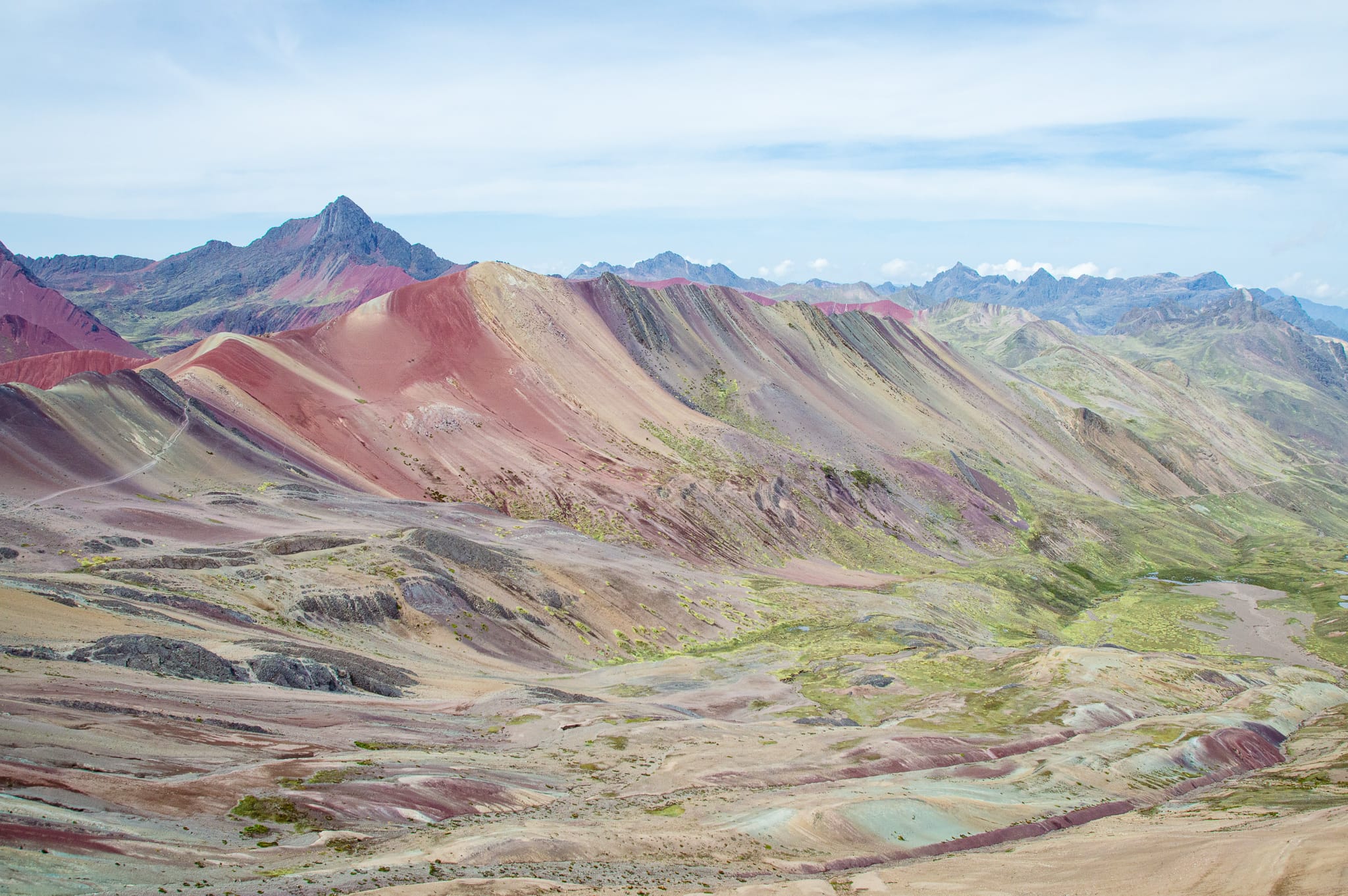 The rainbow mountains in Peru is one of the most beautiful places I've visited. The rainbow mountains photography I captured on our 1 day trek will inspire, and make it worth visiting the mountains. My itinerary provides what to wear, outfits, food, how to get there and more. | Her Life Adventures | #rainbow #mountains #peru #photography #outfit #beautiful #places #trek #travel #destinations #food #itinerary