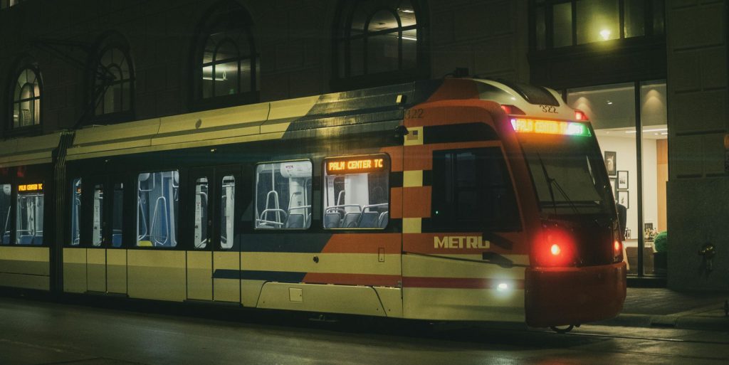 A METRO train in Houston at night, showcasing urban transportation in the city's downtown area.