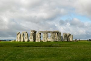 A stunning view of Stonehenge against a backdrop of dramatic clouds.
