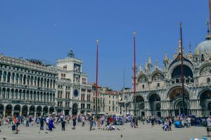 Crowded Saint Mark's Square in Venice with iconic Basilica di San Marco.