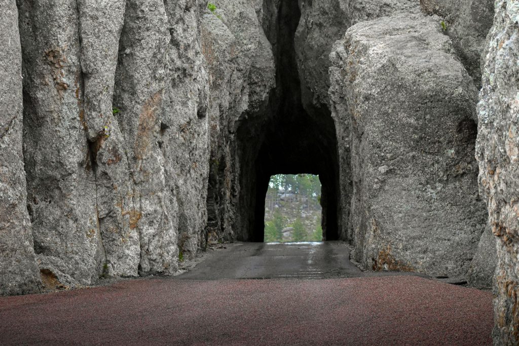 Dramatic view through a granite tunnel on Needles Highway in South Dakota's Custer State Park.