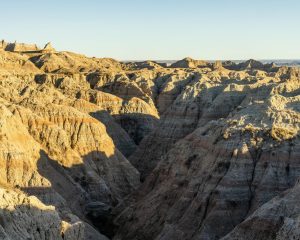 Explore the rugged formations of Badlands National Park's breathtaking landscape at dawn.