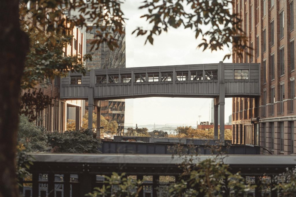 Modern architecture with a bridge over the High Line in New York City highlighting urban design.