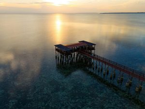 Serene aerial view of a pier at sunset in Kizimkazi Dimbani, Tanzania.