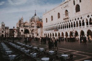 Street view of St. Mark's Square, featuring Doge's Palace in Venice, Italy. Vibrant urban scene.