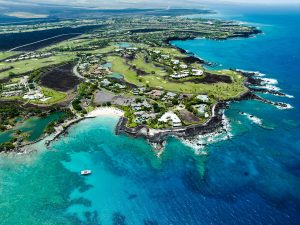 Stunning aerial shot of Waimea, HI showcasing the coastline and tropical scenery.