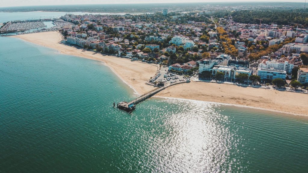 Stunning aerial view of Arcachon in Nouvelle-Aquitaine, France, highlighting the coastline and cityscape.