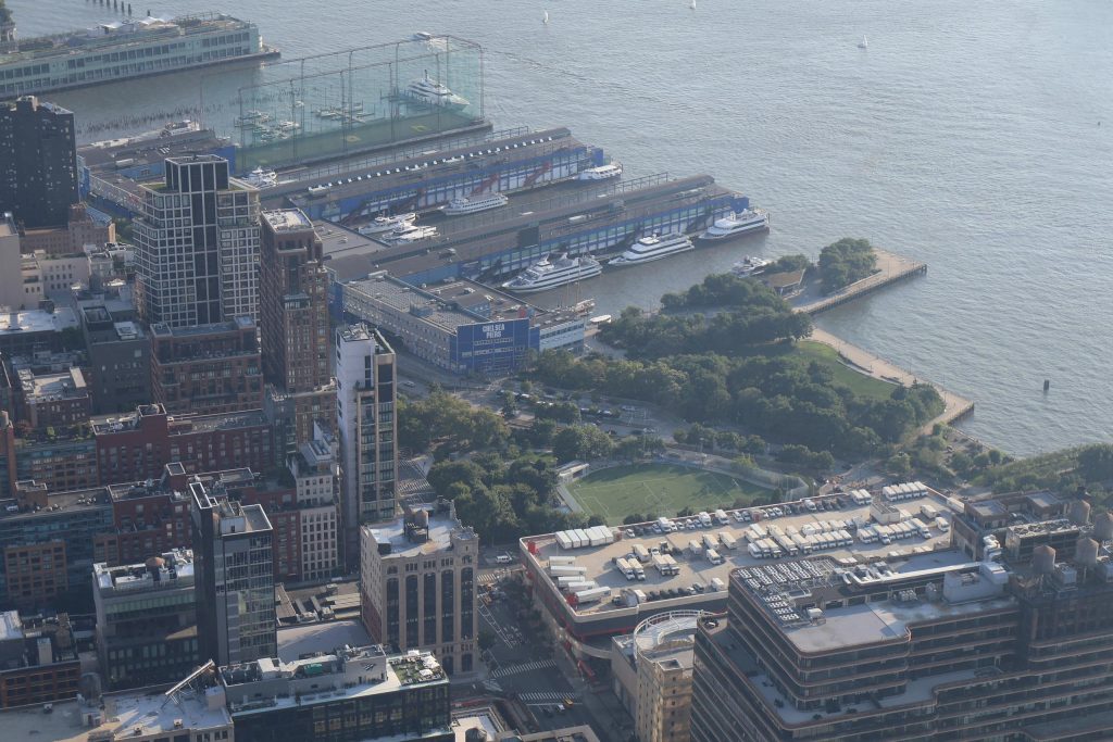 Stunning aerial view of Chelsea Piers and Manhattan skyline along the Hudson River.