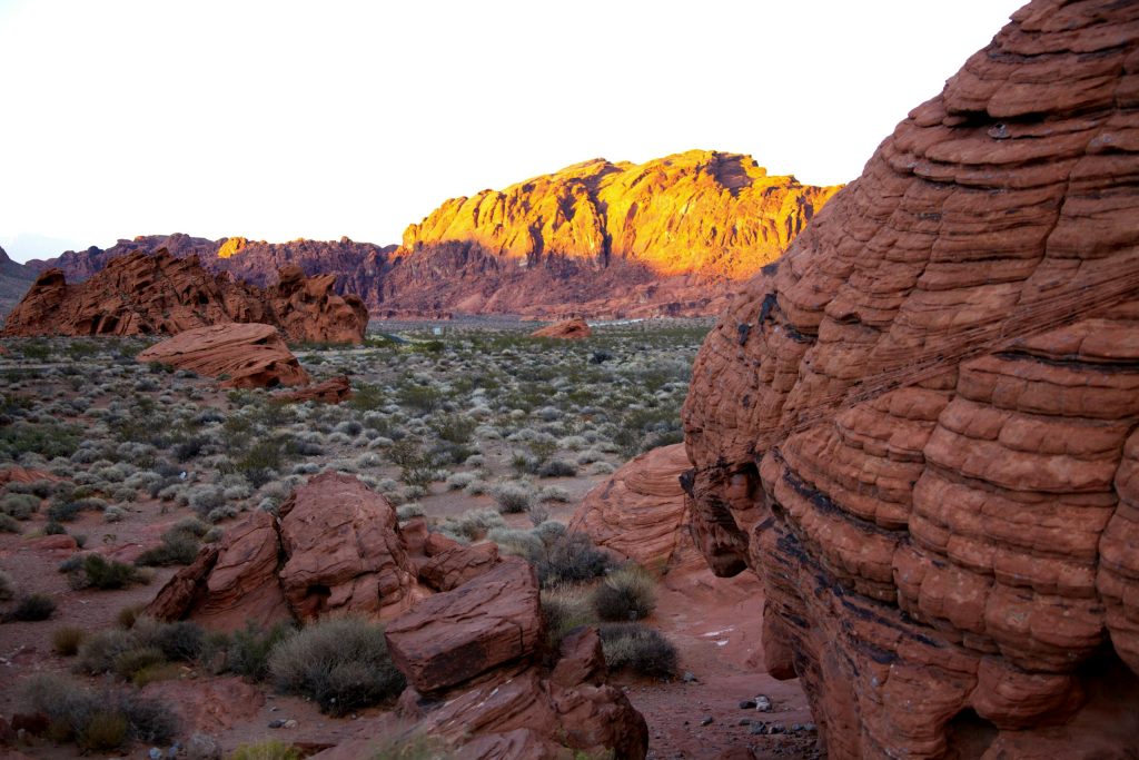 Stunning sandstone formations at sunset in a desert landscape, capturing erosion and geological beauty.