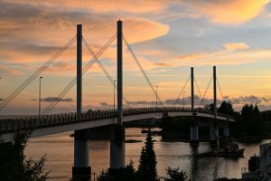 Stunning view of the O'Connell Bridge in Sitka, Alaska at sunset, showcasing dramatic skies.