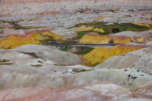 Vibrant, rolling landscape of Badlands National Park with earthy tones.