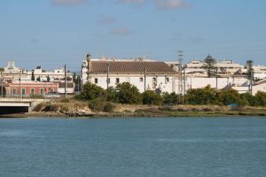 View of a historic monastery by the Guadalete River in El Puerto de Santa María, Spain.