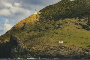 Cape Brett Lighthouse sits on a rugged hill in the scenic Northland Region, New Zealand.