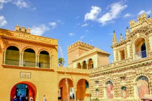 Capture of the Royal Alcazar's detailed facade in sunny Seville, Spain.
