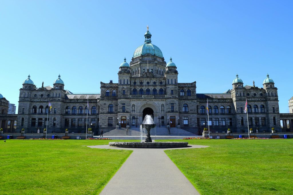 Stunning view of the British Columbia Parliament Building with clear blue sky.